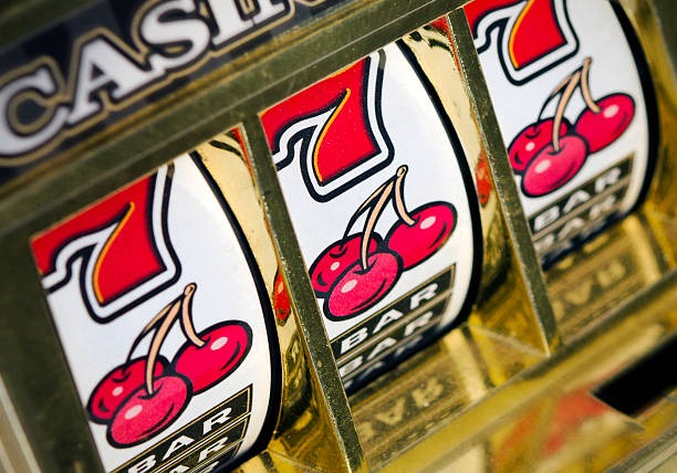 Live dealer rolling three dice in Lightning Dice game